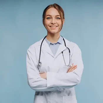 Woman doctor wearing lab coat with stethoscope isolated